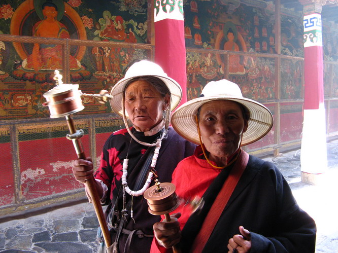 Tibetan woman walking around the Jokhang temple. Lhasa, Tibet.
